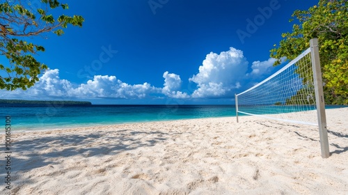 Beautiful beach with a volleyball net under a bright blue sky on a sunny day