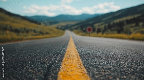 Wallpaper Mural Long highway stretching through scenic mountains under a bright blue sky during daytime Torontodigital.ca