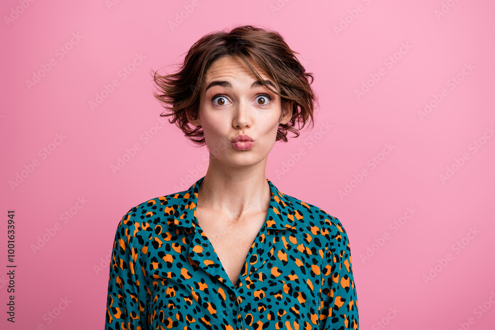 Portrait of lovely funky impressed woman with bob hairdo wear print blouse astonished staring plump lips isolated on pink color background Portrait of lovely funky impressed woman with bob hairdo wear print blouse astonished staring plump lips isolated on pink color background