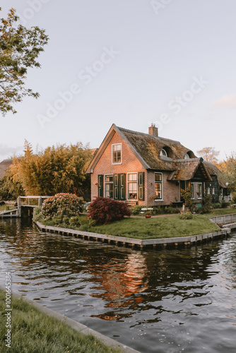 House in Giethoorn on canal. Picturesque home in Venice of the North in The Netherlands. Travel destination, explore, town, tourism