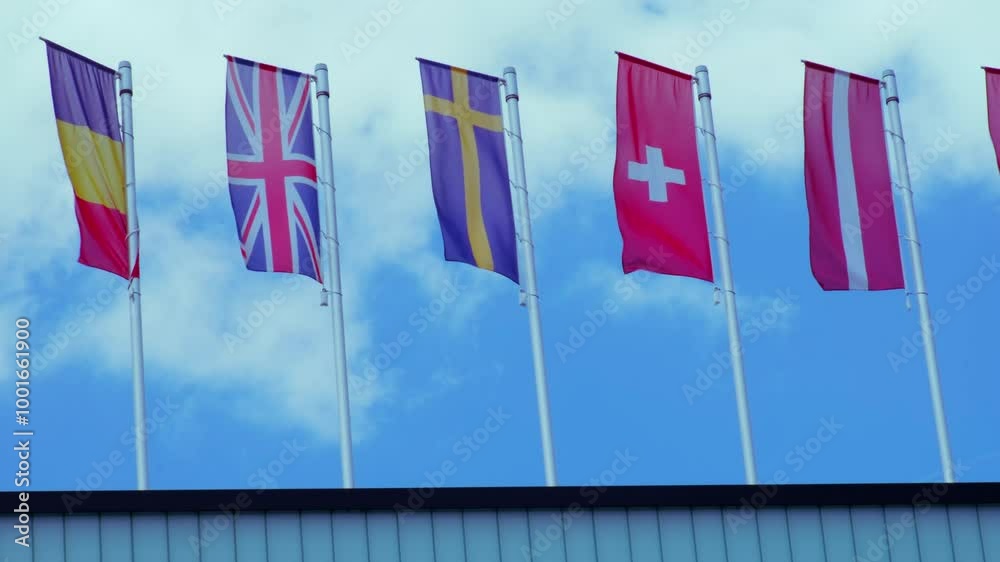 national flags Europe and other countries on satin flutter in wind in blue sky, European Space Agency, state symbols, concept of international cooperation, global business