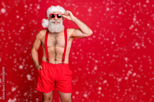 Portrait of his he nice attractive content cheerful cheery funky glad optimistic gray-haired man touching specs enjoying leisure December dream isolated over bright vivid shine red background