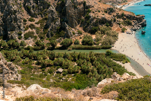 Preveli Beach, Crete, Greece- July 18, 2024: People swimming at The Cretan Sea, Preveli Beach in summer season