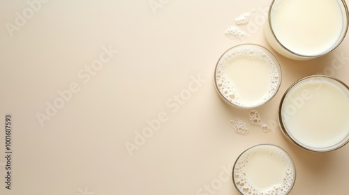 Fresh Goat Milk in Glasses on Beige Background