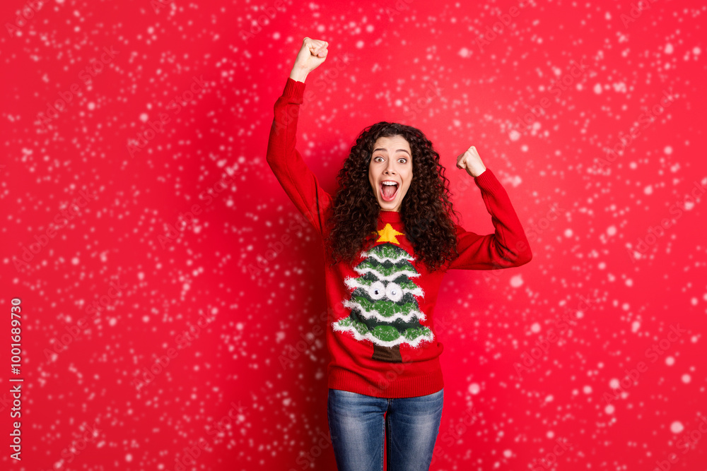 Wow unbelievable newyear party Portrait of crazy funny funky girl raise fists scream yeah celebrate x-mas wear traditional seasonal clothes with christmas tree decor isolated red color background Wow unbelievable newyear party Portrait of crazy funny funky girl raise fists scream yeah celebrate x-mas wear traditional seasonal clothes with christmas tree decor isolated red color background