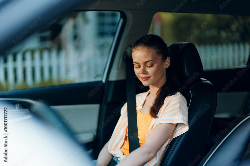 Calm woman sitting in a car with a relaxed expression, wearing a casual outfit The interior features sleek design Photogenic moment capturing tranquility and introspection