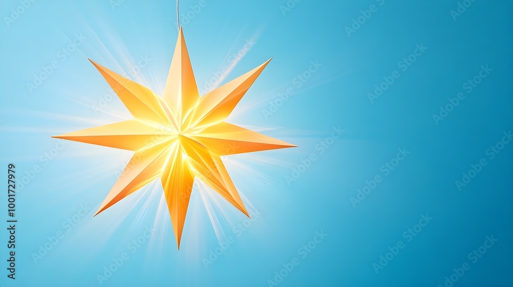 Obraz premium a stylized, bright, golden star with eight points. It is set against a clear blue background. The star appears to be glowing, with light radiating from its center, giving it a luminous and vibrant app