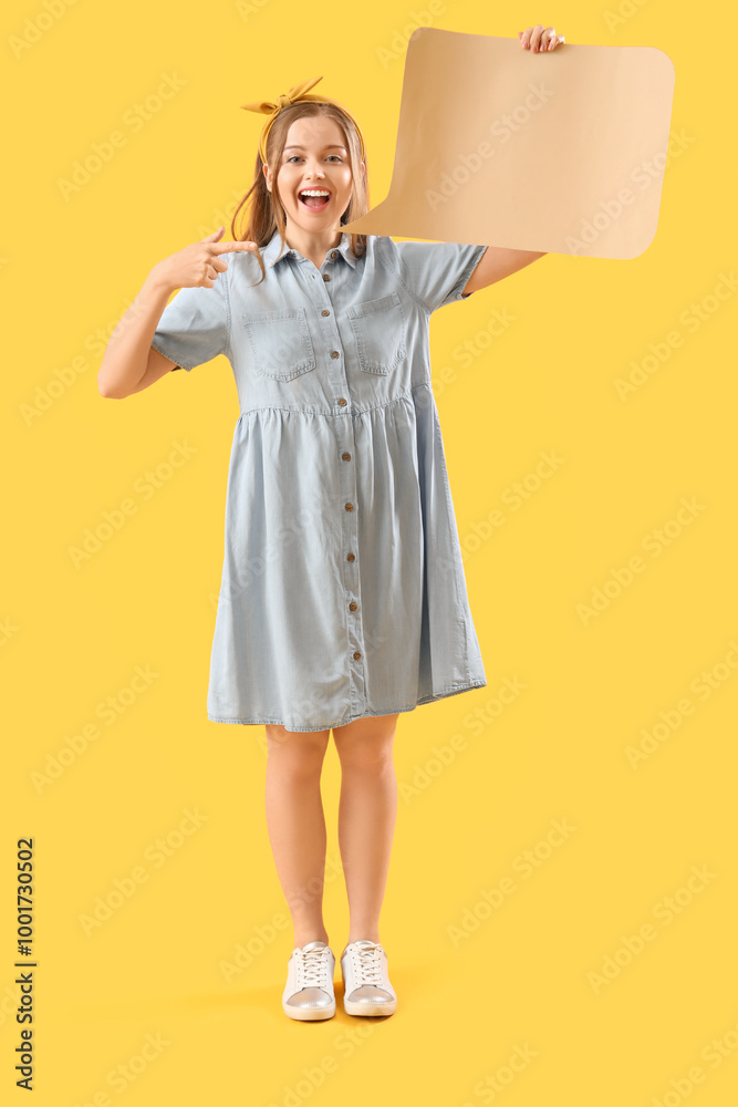 Happy young woman with blank speech bubble on yellow background Happy young woman with blank speech bubble on yellow background