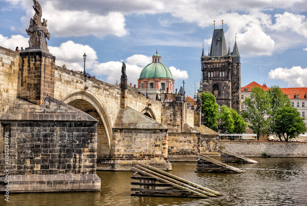 Obraz premium Prague, Czech Republic - July 19, 2024: Morning views along the Vltava River and Charles Bridge n Prague in the Czech Republic 