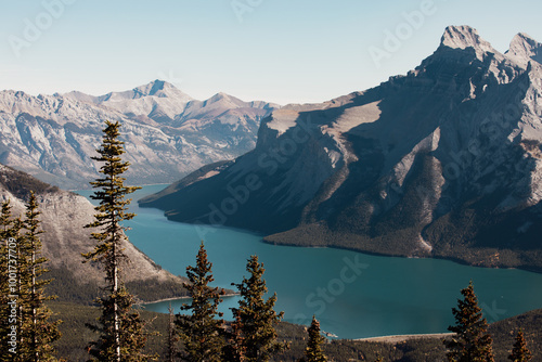 Fototapeta Naklejka Na Ścianę i Meble -  view of a turquoise water lake in the mountains in summer with hard sun light and shadows