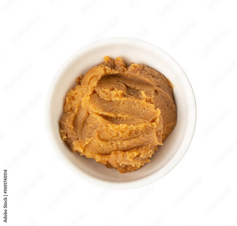Miso paste isolated. Japanese shiro miso seasoning sauce, fermented soybean spread, brown soy cream Miso paste isolated. Japanese shiro miso seasoning sauce, fermented soybean spread, brown soy cream