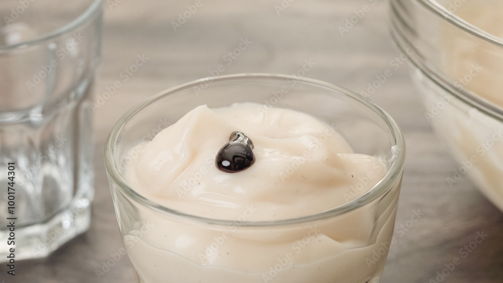 Topping vanilla pudding with chocolate sauce Topping vanilla pudding with chocolate sauce