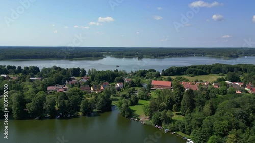 small village at lakes and forests in summer. Lovely aerial view flight drone photo