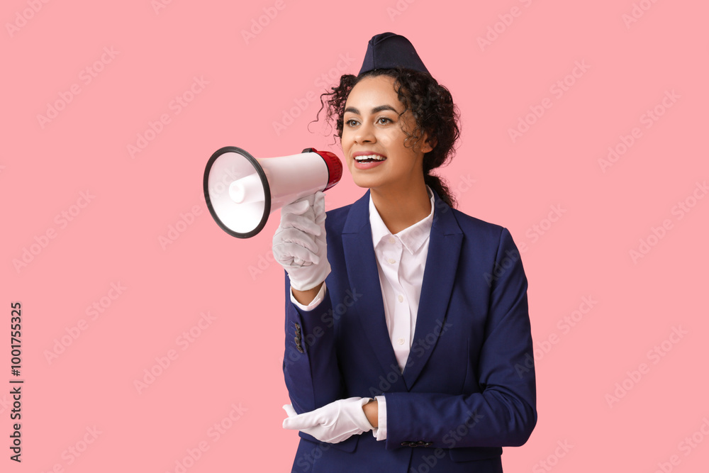 Beautiful African-American stewardess with megaphone on pink background Beautiful African-American stewardess with megaphone on pink background