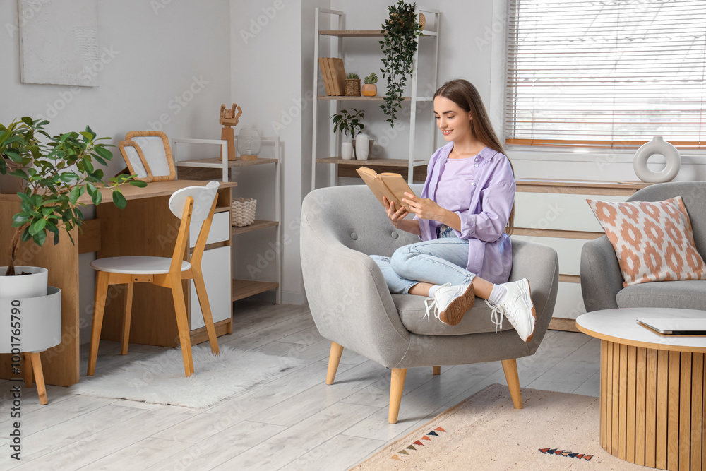 Young beautiful woman reading book on armchair at home Young beautiful woman reading book on armchair at home