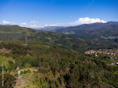 Beautiful and scenic aerial view of village of Gerês, Soajo, Portugal. Spring day. City, houses, mountains and waterfalls. Near Porto. Drone.