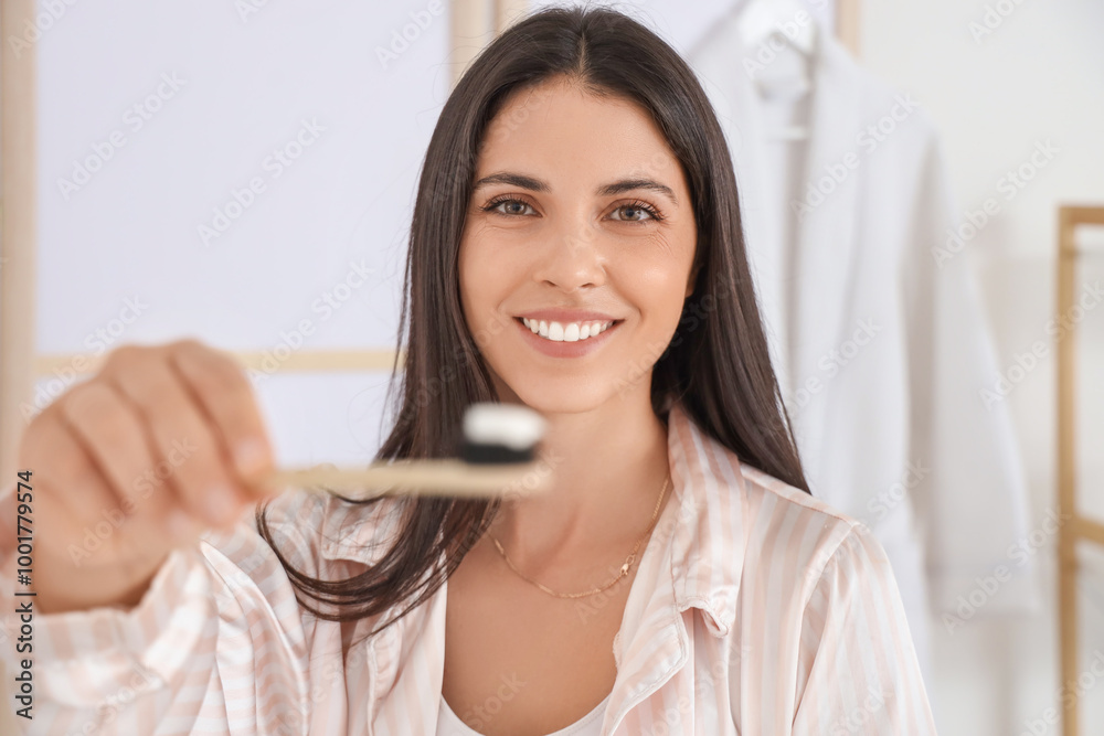 Morning of beautiful woman brushing teeth in bathroom, closeup Morning of beautiful woman brushing teeth in bathroom, closeup