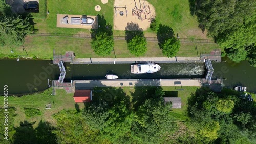 boats in sluice canal lock on summer day. Unique aerial view flight drone photo