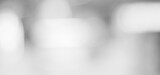 Blur white abstract background, blurred grey gradient bright light with copy space backdrop, banner, blank mordern business office interior hallway building design background, monochrome