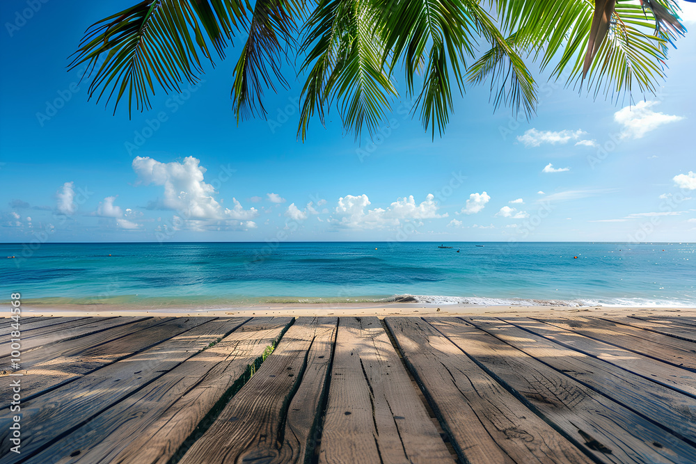 Wooden floor with blurred background of tropical beach and sea, panoramic view, blue sky and white clouds, palm trees, summer vacation concept, space for product display or montage Wooden floor with blurred background of tropical beach and sea, panoramic view, blue sky and white clouds, palm trees, summer vacation concept, space for product display or montage