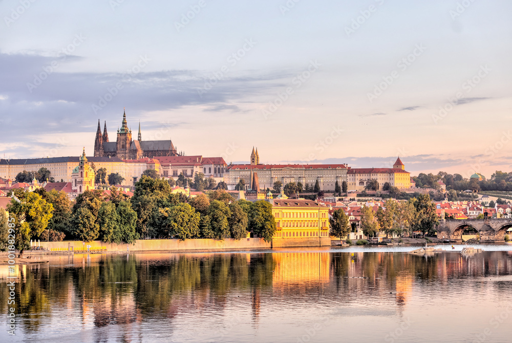Fototapeta premium Prague, Czech Republic - July 19, 2024: Early morning views of the Vltava River and the Charles Bridge in Prague in the Czech Republic 