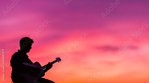 A silhouetted musician strums an acoustic guitar against a striking sunset backdrop. The warm colors radiate passion and energy, evoking the spirit of live performance