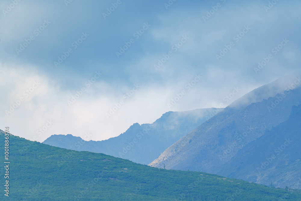 Mountain range with mist and clouds Mountain range with mist and clouds