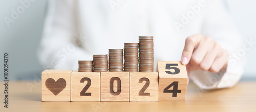 2024 end year to Happy New Year 2025 with Doctor, heart shape and coins stack. Money for Healthcare cost, Money Saving, Health Insurance, Medical, Donation and Financial concept