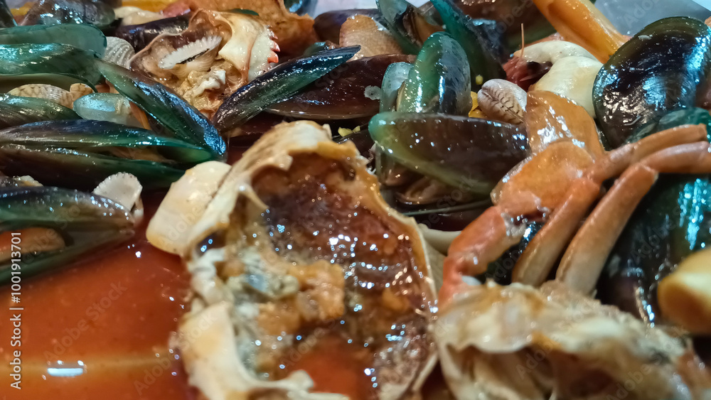 Close up of various seafood dishes with crab and shells Close up of various seafood dishes with crab and shells
