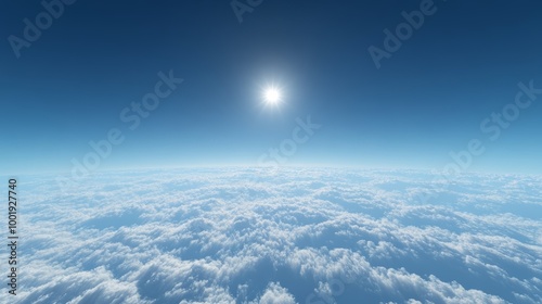 A serene morning sky above sparse clouds, deep blue with a small bright sun