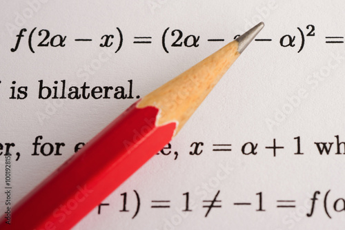 Pencil on mathematic formula exercise test paper in education school.