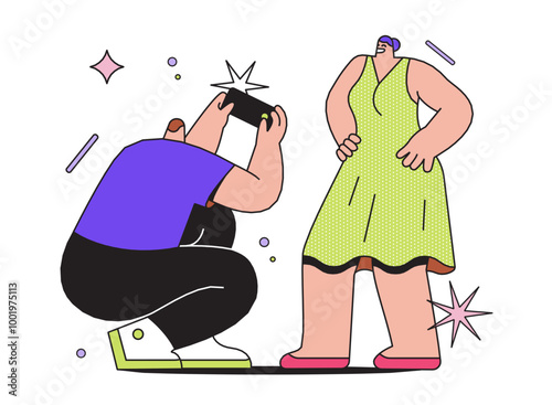 Man sitting and taking photo of woman