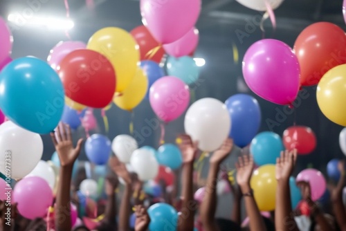 Lively Birthday Celebration with Colorful Balloons and Party Atmosphere at Night photo