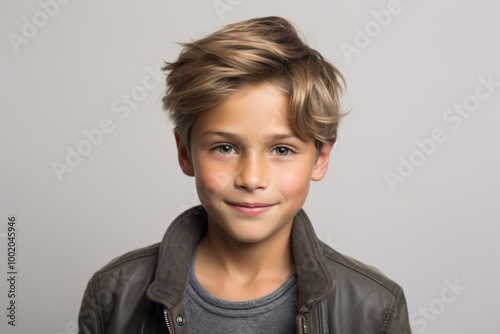 Portrait of a cute little boy with blond hair. Studio shot.