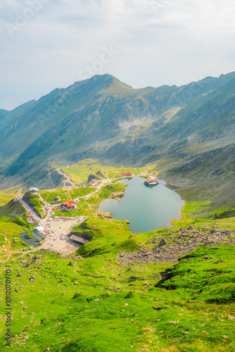 Hiking in Fagaras mountains on Iezerul Caprei peak over Transfagarasan serpentine road carpathian mountains. Mountains landscape photo