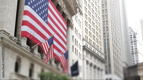 New York City, United States. Lower Manhattan Downtown Financial District urban architecture. Huge big American flag. Wall street Stock Exchange building, USA Stock Market trading.