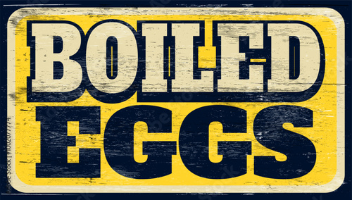 Aged and worn boiled eggs sign on wood