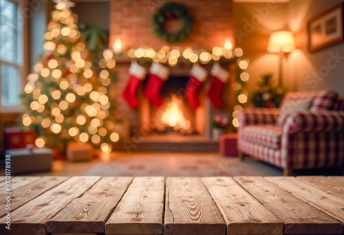 A wooden table in front of a living room with a Christmas tree.