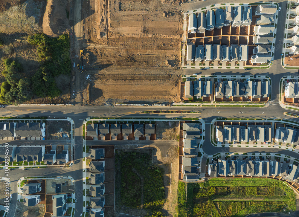 A view of a residential neighborhood with houses and a street