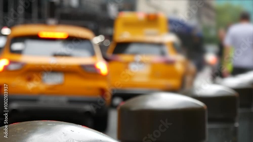 New York City Grand Central Terminal railway station, 42 street. Manhattan Midtown. Yellow taxi cab row, car transport on Pershing Square, NYC, USA. American urban road traffic, people pedestrians.