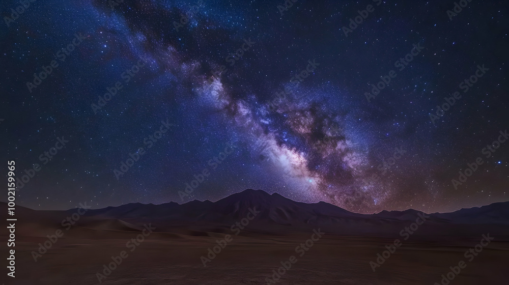 Naklejka premium Milky Way Over Desert Mountains: A Starry Night Landscape