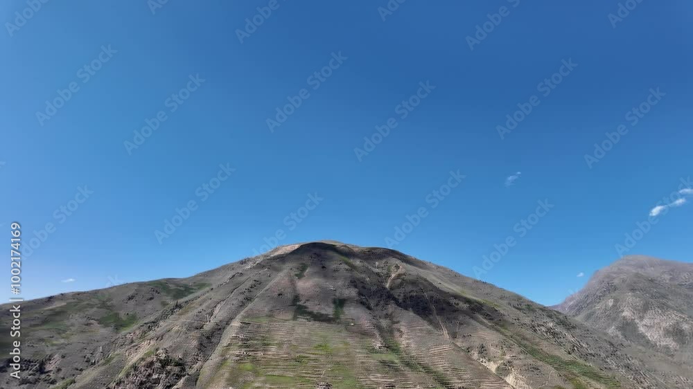 Mountain Landscape Scenic Roadside View with Mountains, Soft Clouds, and Clear Blue Sky 4K Mountain Landscape Scenic Roadside View with Mountains, Soft Clouds, and Clear Blue Sky 4K