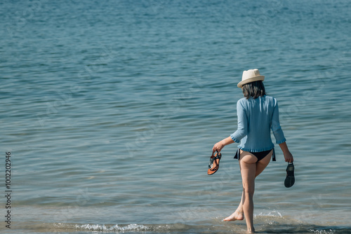 Woman enjoying on the beach relaxed and happy