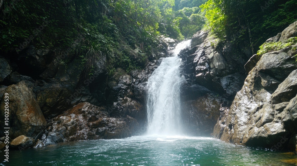 Naklejka premium Scenic waterfall in a tropical holiday destination, leaving ample room for copy.