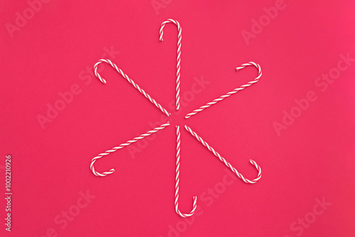 Christmas star with red and white Christmas candy canes, decorative ornaments