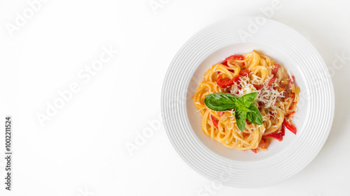 A delicious plate of Italian pasta with basil and cheese topping is perfect for celebrating a cozy Italian dinner