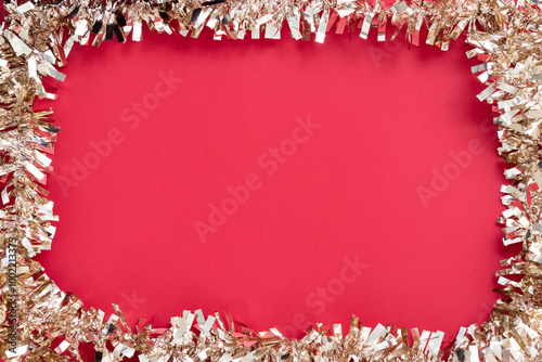 Glossy and gold Christmas ornaments frame on red textured background