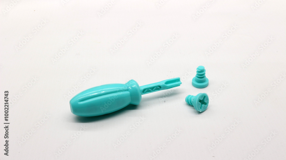 Blue screwdriver toy and nuts isolated Blue screwdriver toy and nuts isolated