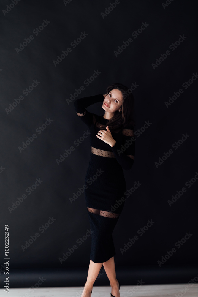 Beautiful slim fashion woman in black evening dress Beautiful slim fashion woman in black evening dress