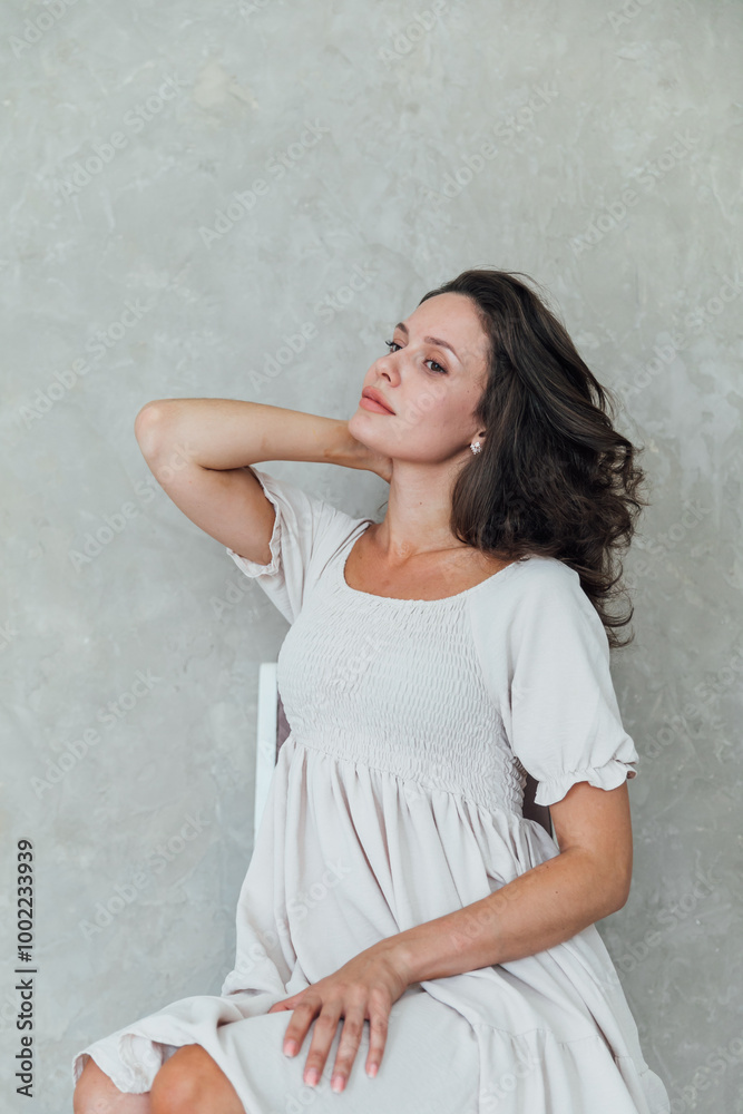 Beautiful fashionable woman in light summer dress Beautiful fashionable woman in light summer dress